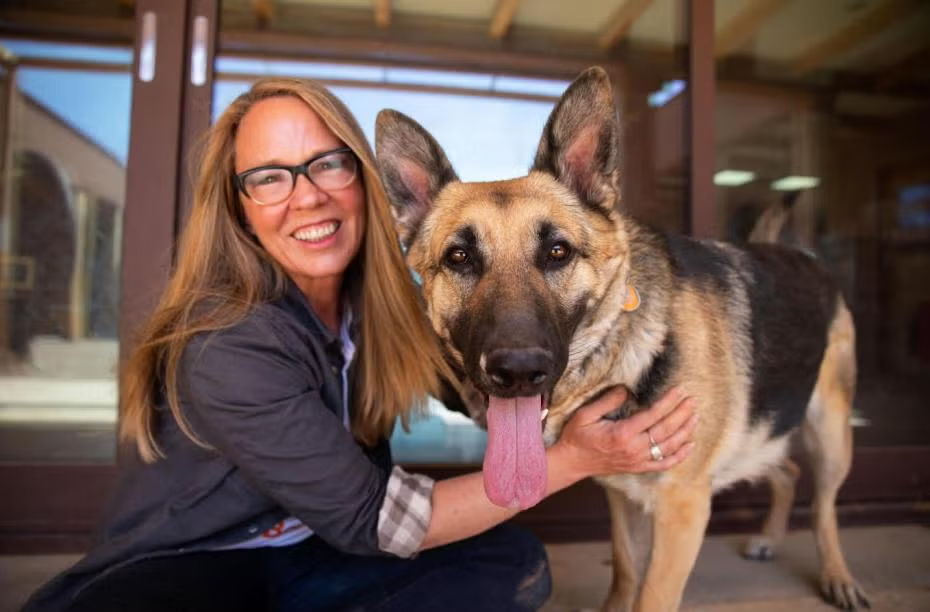 Best Friends Chief Executive Officer and a german shepard